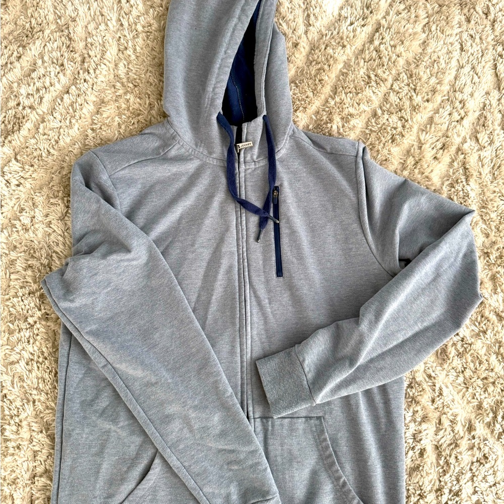 Jockey men’s hoodie. Zip up gray w/navy on zipper, lace, & inside of hoodie.